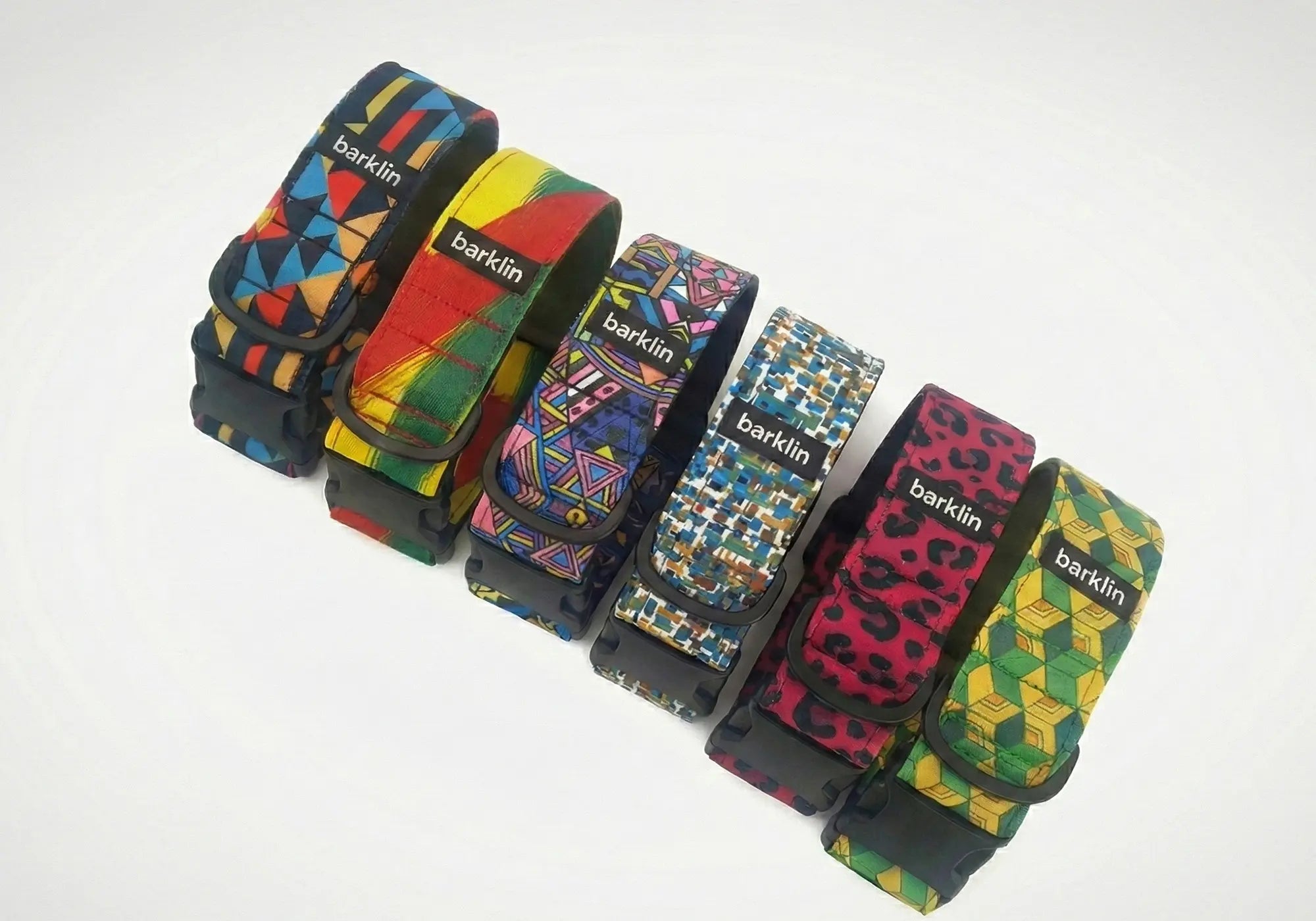 Five Genesis Drop dog collars arranged in a row, REPREVE canvas with ECONABLE buckles, studio white background.